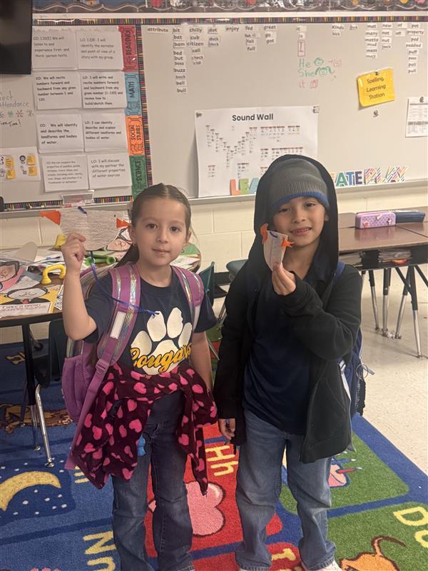Kids posing with finished products.