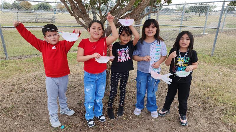 Kids posing with finished product.