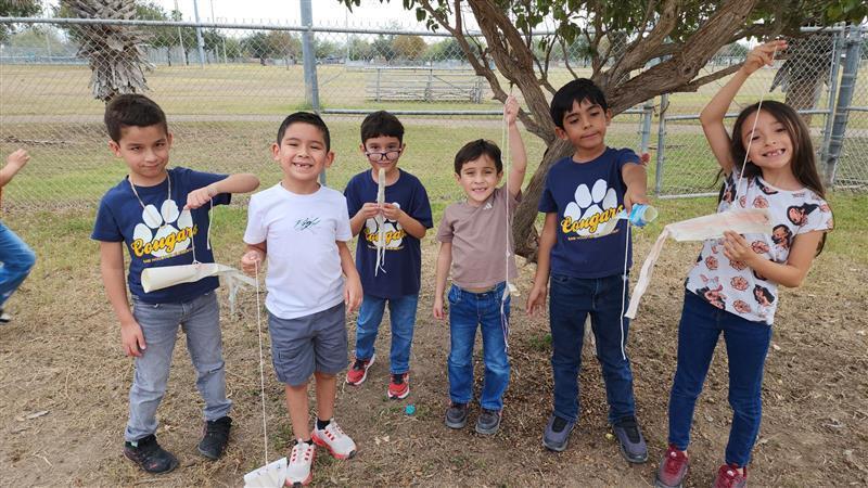 Kids posing with finished product.