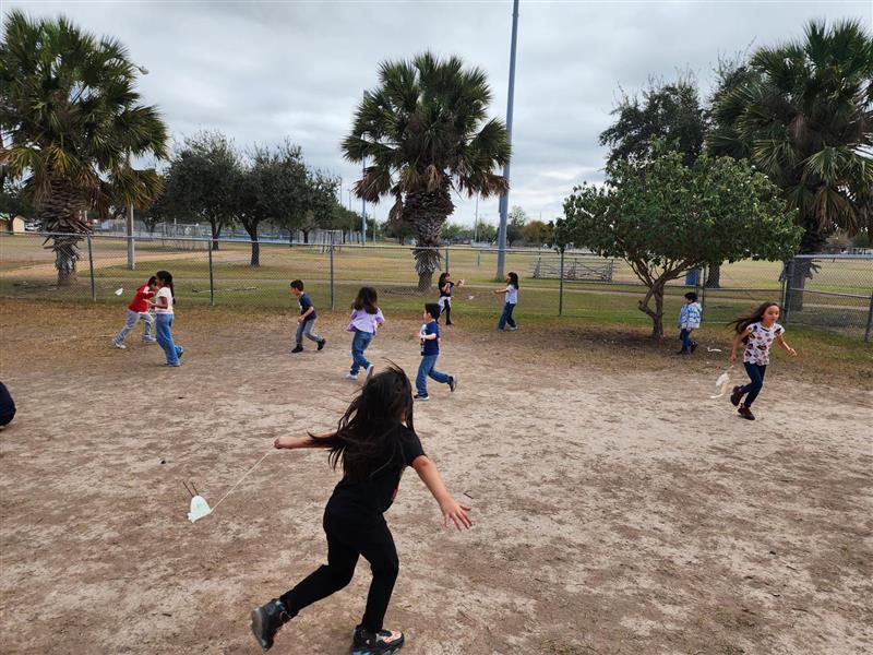 Kids running outside testing their products.