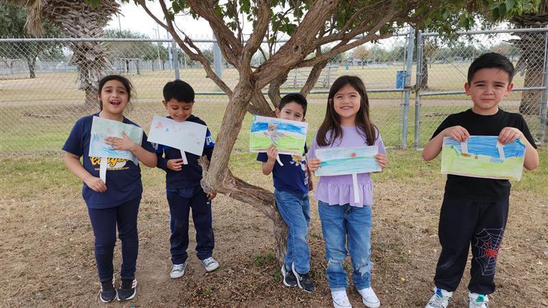 Kids posing with finished product.
