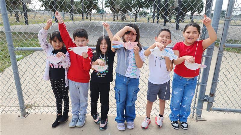 Kids posing with finished product.