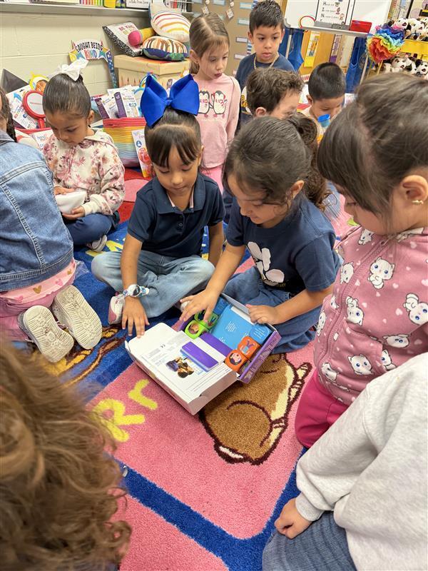 Kids opening packages with the peace pod tools.