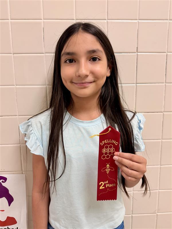 Kid posing with ribbon.