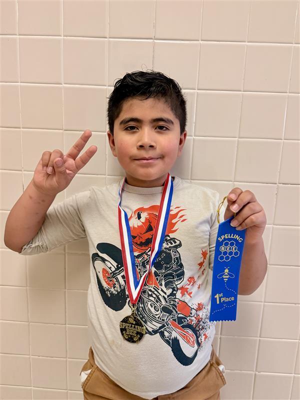 Kid posing with ribbon.