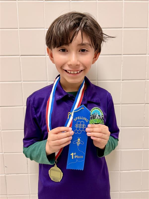 Kid posing with ribbon.