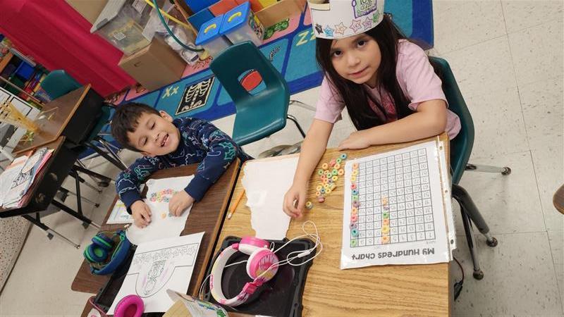 Kids posing while completing activity.