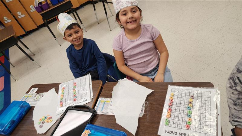 Kids posing while completing activity.