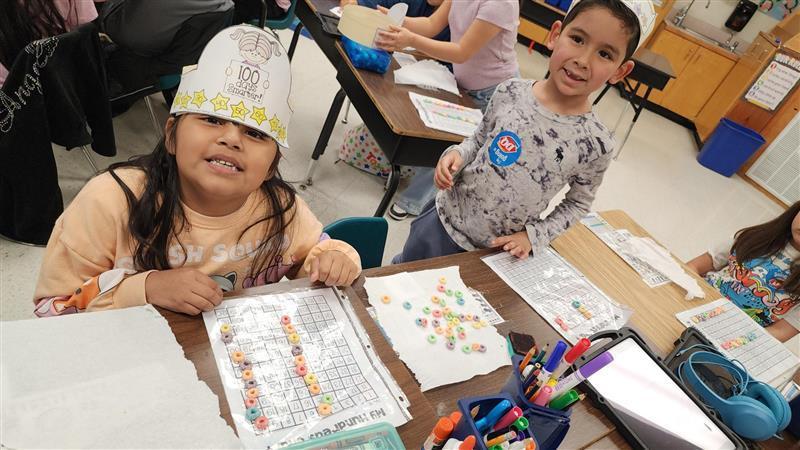 Kids posing while completing activity.