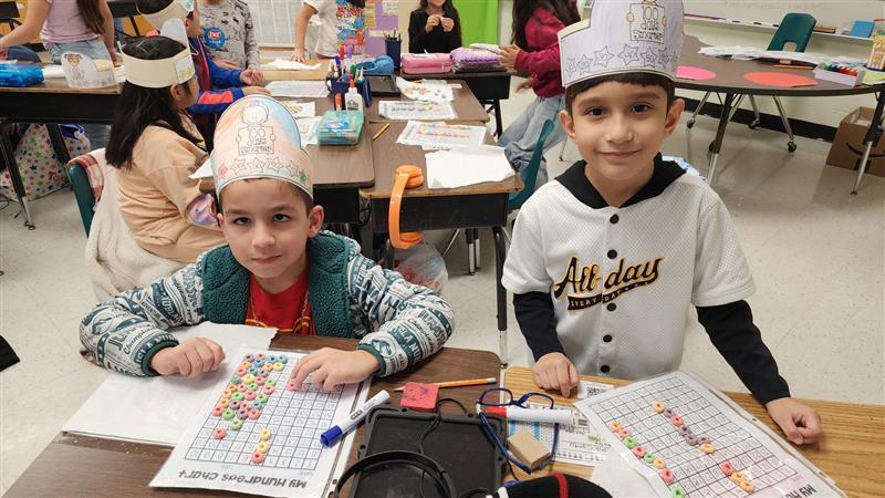 Kids posing while completing activity.