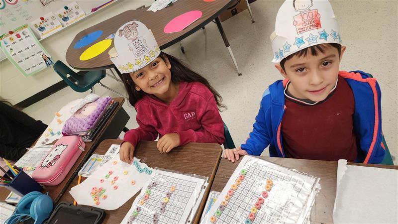 Kids posing while completing activity.