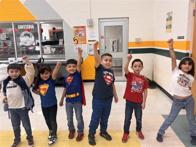 Kids posing as superheroes.