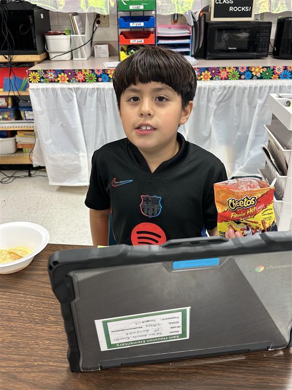 Students posing with treat.