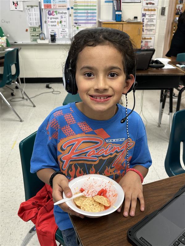 Students posing with treat.