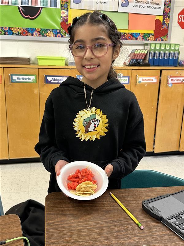 Students posing with treat.