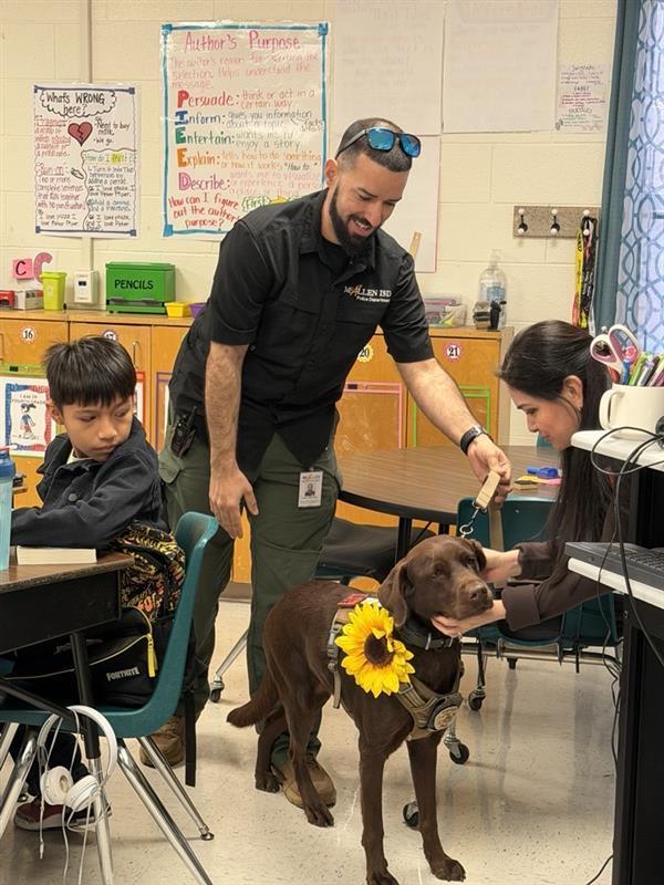 Teacher petting student.