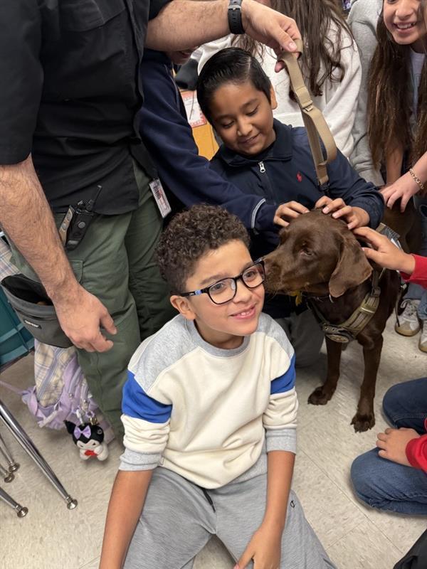 Penny loving on students.