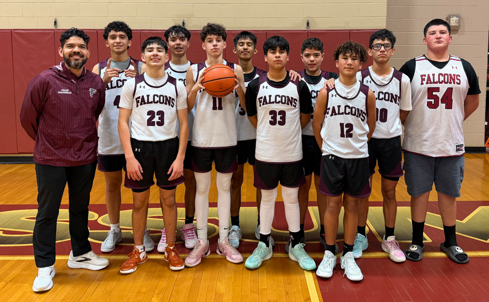 Fossum boys basketball teams poses for team photo