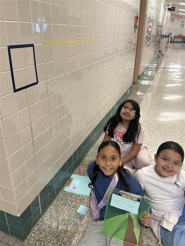 Kids working with fractions on a number line.