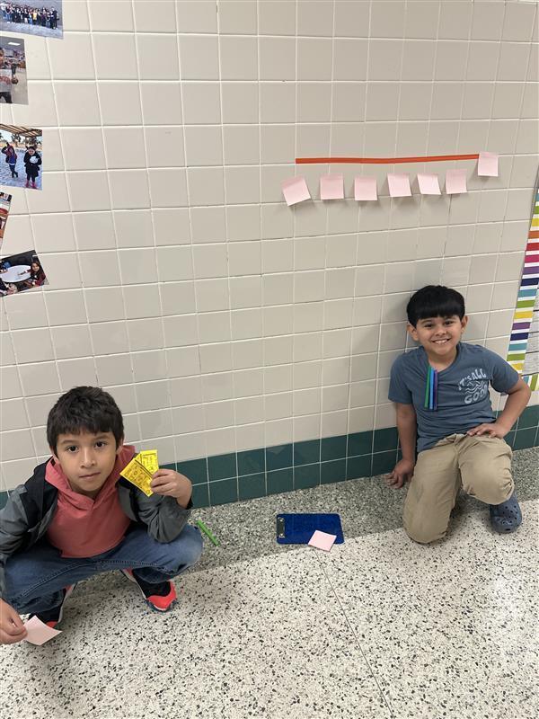 Kids working with fractions on a number line.