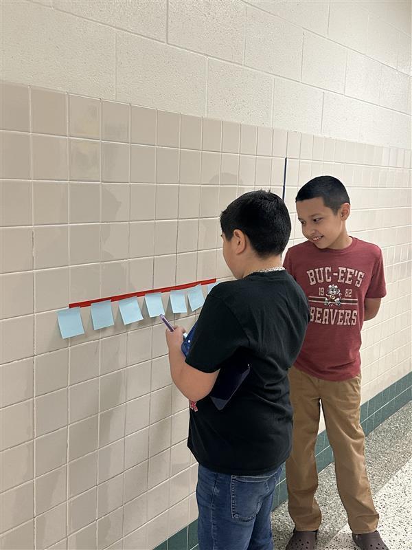 Kids working with fractions on a number line.
