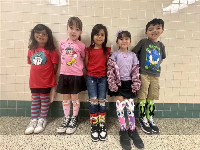 Kids posing with silly socks.