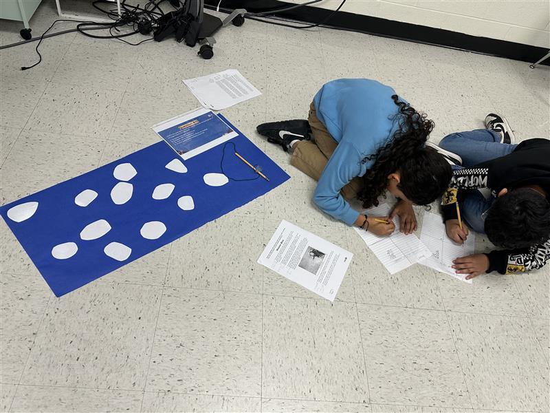 Kids engaged in a reading STAAR activity. 