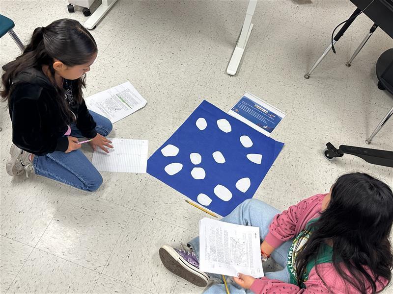 Kids engaged in a reading STAAR activity. 