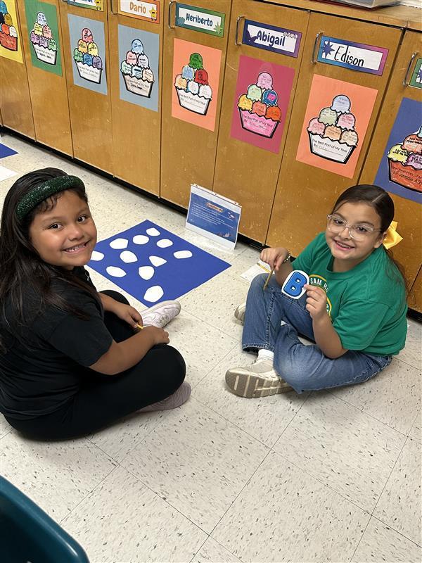 Kids engaged in a reading STAAR activity. 