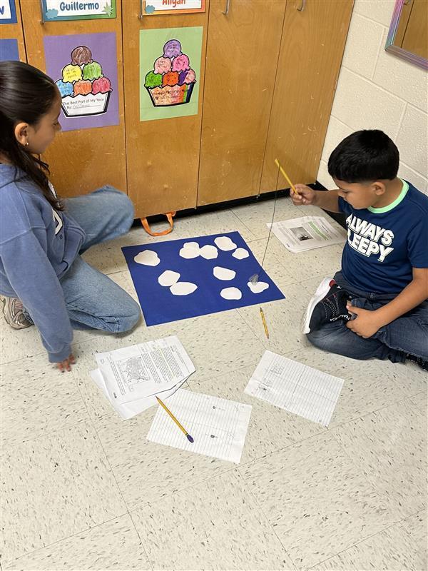 Kids engaged in a reading STAAR activity. 
