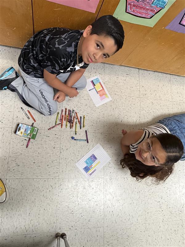 Kids posing as they complete game activity.