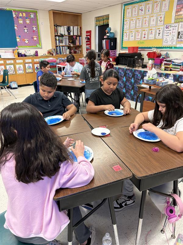 Kids completing Earth Day Activity.