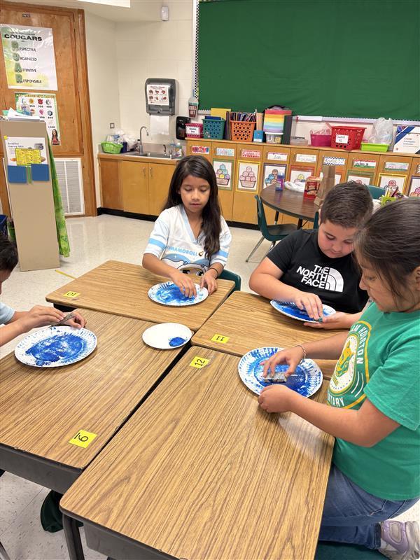 Kids completing Earth Day Activity.