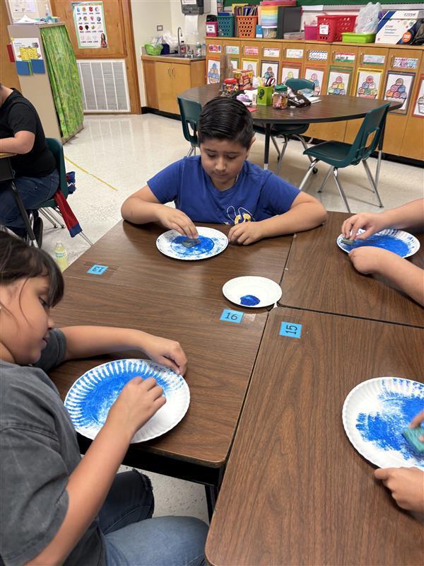 Kids completing Earth Day Activity.