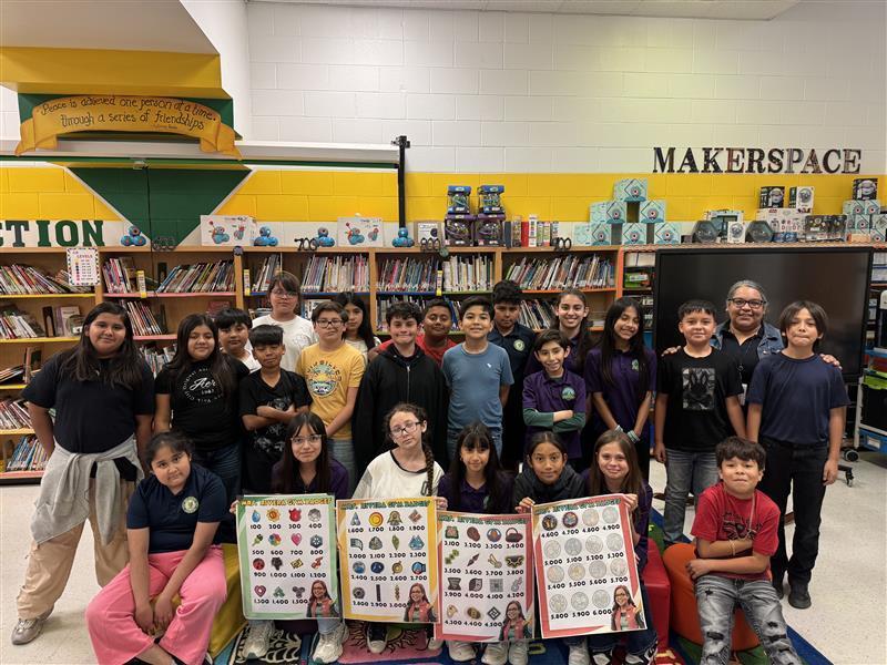 Kids posing with A.R. posters.