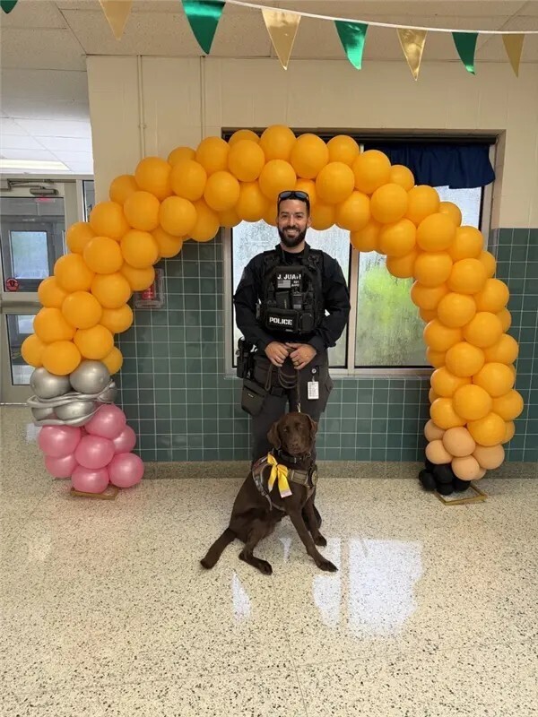 Officer and K9 officer posing.