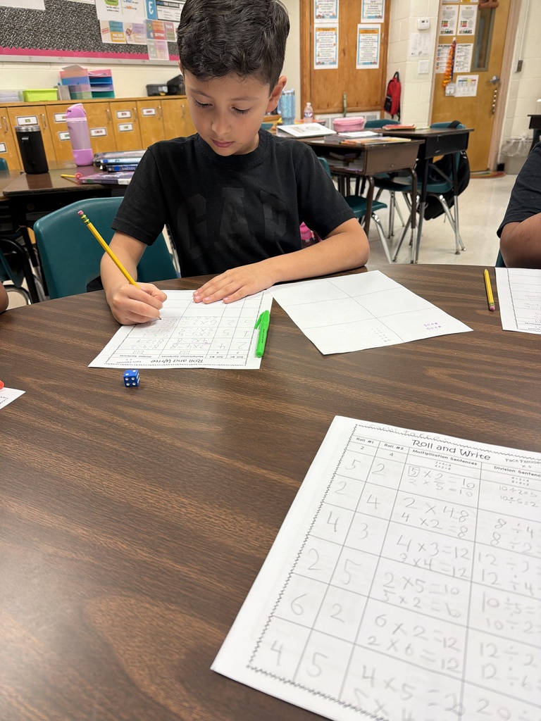 Student completing fact family practice.