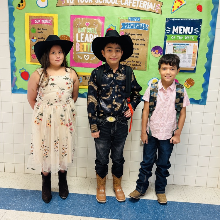 Students Wearing western attire against green background.