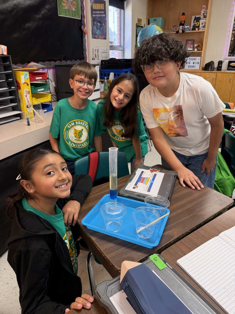 Kids posing during a science lesson.