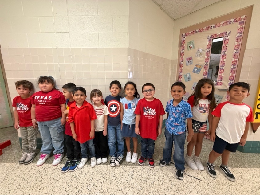 Students posing wearing red, white, and blue.