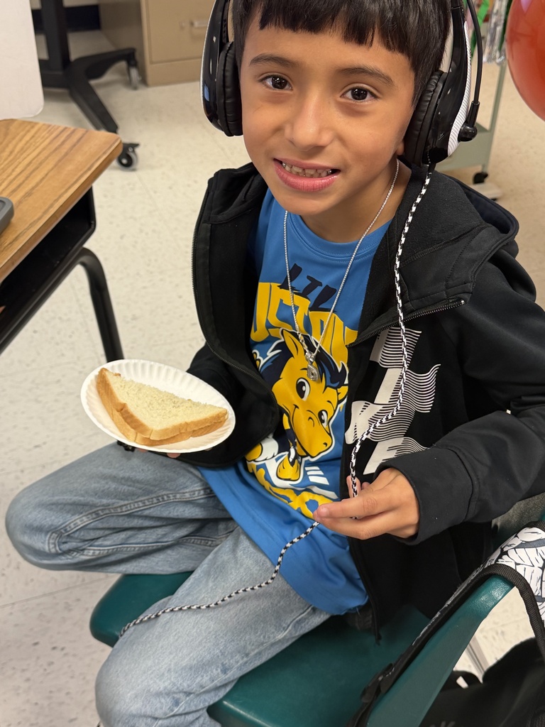 Student posing with sandwich.