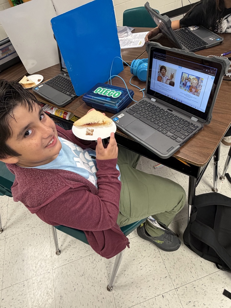 Student posing with sandwich.