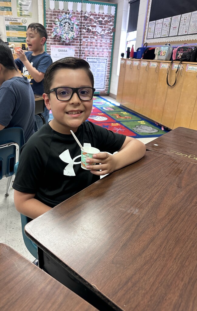 Student eating ice cream.