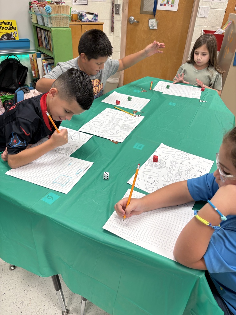Students engaged in math/science activity.