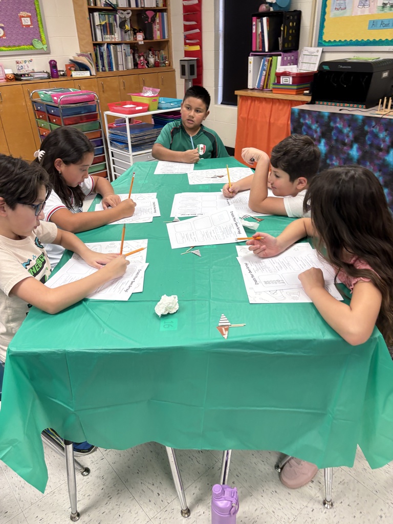 Students engaged in math/science activity.