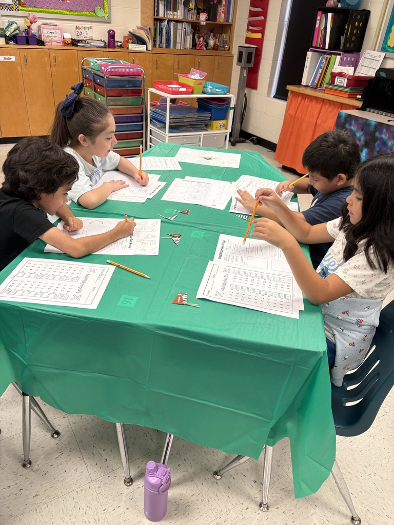 Students engaged in math/science activity.