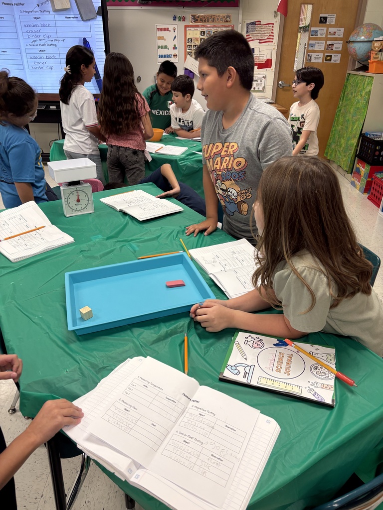 Students engaged in math/science activity.