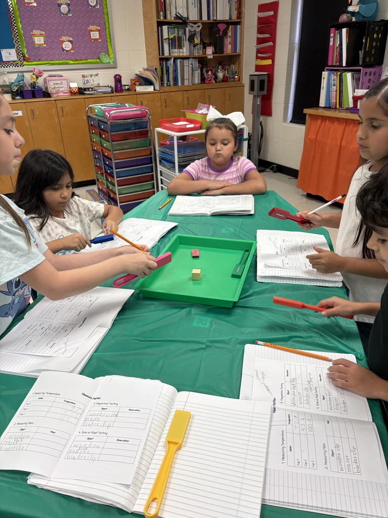 Students engaged in math/science activity.
