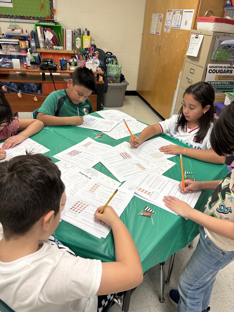 Students engaged in math/science activity.