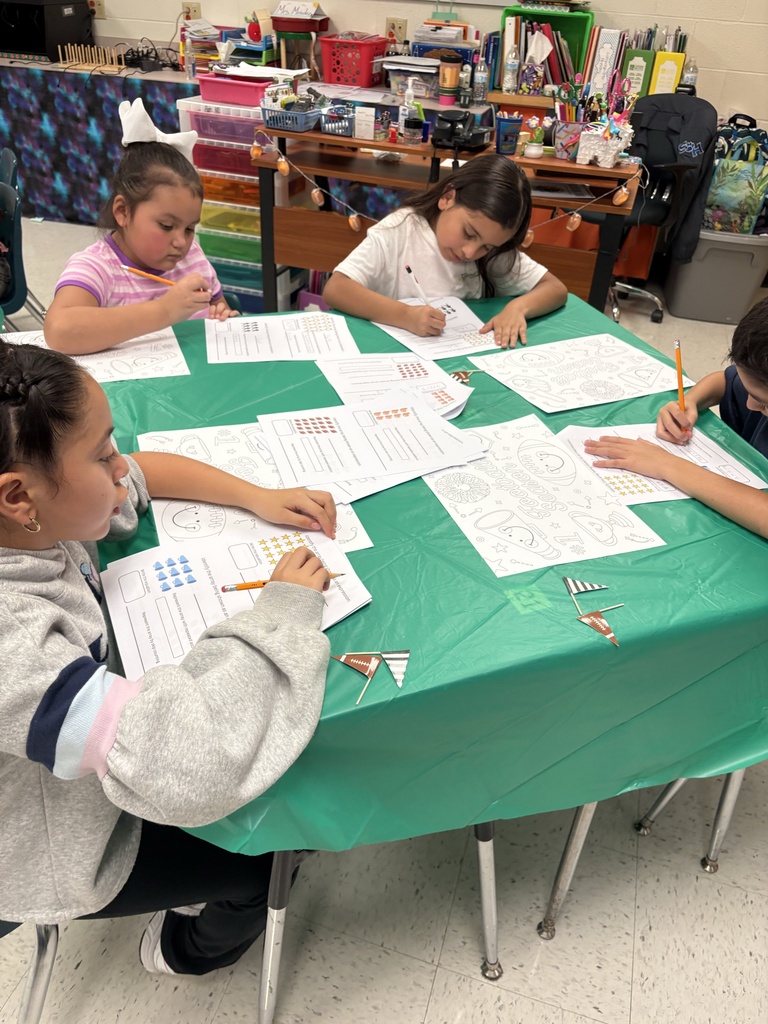 Students engaged in math/science activity.